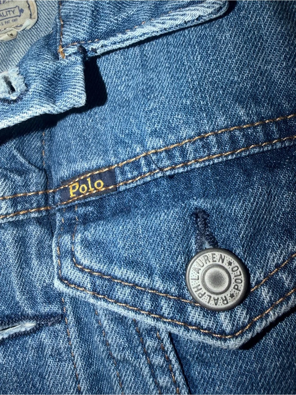 Ralph Lauren Polo Light Blue Denim distressed Jacket. Polo print on the back.